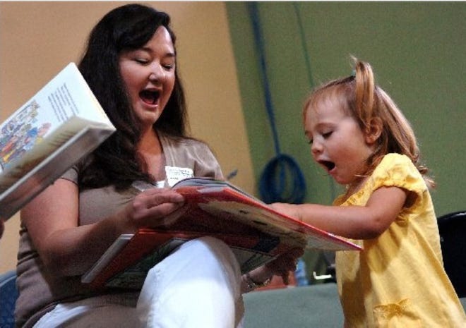 Terissa Aronson, left, of Port St. Lucie, shares a few moments with Dalton Burlison, 2, after reading to children while their mothers shop at the Harvest Food & Outreach Center on Orange Avenue in Fort Pierce on Saturday Jan. 30, 2010. Aronson , along with several other "readers" are volunteering their time in the "Give a day, get a Disney Day " promotion that helps nonprofit organizations to recruit volunteers. In February 2023, Aronson, the president and CEO of the St. Lucie County Chamber of Commerce, announced she would run for School Board.