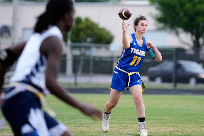 Martin County's Cali Scornavacca (11) throws a pass against Centennial in a Region 3-2A girls high school flag football quarterfinal Tuesday, May 3, 2022 in Stuart. Martin County won the quarterfinal in overtime 20-14.