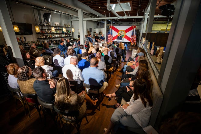 A group of supporters gathers at The Fire restaurant in Winter Haven to listen to Gov. Ron DeSantis and Surgeon General Joseph Ladapo on Thursday.