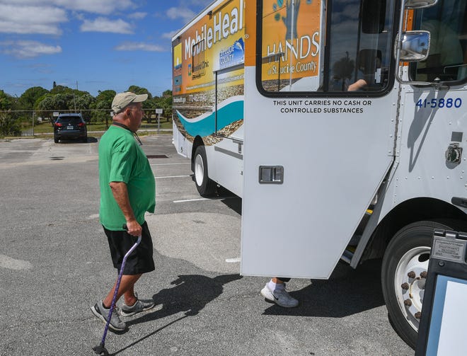 Richard Champion, a Fort Pierce resident residing in the St. Lucie County Housing Hub, walks to the HANDS Clinic mobile healthcare van parked at the shelter on North 7th Street on Thursday, March 16, 2023, in Fort Pierce. Champion uses the services of the mobile clinic to help manage his diabetes and other medical needs.