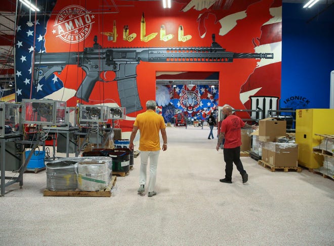 Owners Barry Skolnick (left) and Austin Weiss (right) give a tour of the new Grind Hard Ammo facility, Thursday, Feb. 23, 2023, at the Willoughby Business Park in Stuart. "We want to make the best ammo," said Skolnick. Grind Hard Ammo manufactures copper shell casings at the Stuart facility and plans to build a facility in Indiantown, where they would make primers, or the explosive substance that energizes the powder in the case of each shell. The company primarily sells ammunition to law enforcement and the military. Its website sells consumer ammunition and merchandise such as T-shirts and hats. The facility is not open to the public.