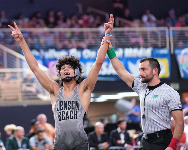 Jensen Beach senior Jewell Williams celebrates going back-to-back as a state champion after defeating First Baptist's Michael Kersey with a 6-0 decision in the 1A 145-pound final at the FHSAA Championships held at Silver Spurs Arena on Saturday, Mar. 4, 2023 in Kissimmee.