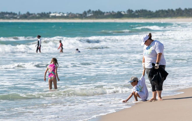 "World Oceans Day helps us remember that our oceans are important and they need to be protected by us," said Jamie Packer (right) who lets her nephew, Tristan Jamison, 5, both of Fort Pierce, play in the surf while they walk the shoreline  on Saturday, June 5, 2021, at South Beach Park in Vero Beach. Locals and tourists alike enjoy time on the beaches along the Treasure Coast