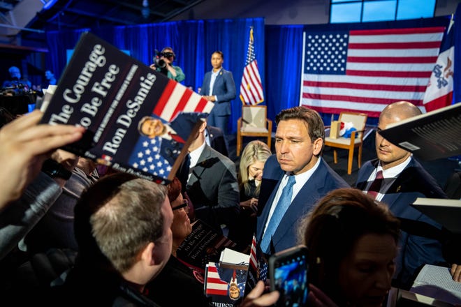 Florida Gov. Ron DeSantis greets supporters and signs books at an event in Des Moines, Friday, March 10, 2023.
