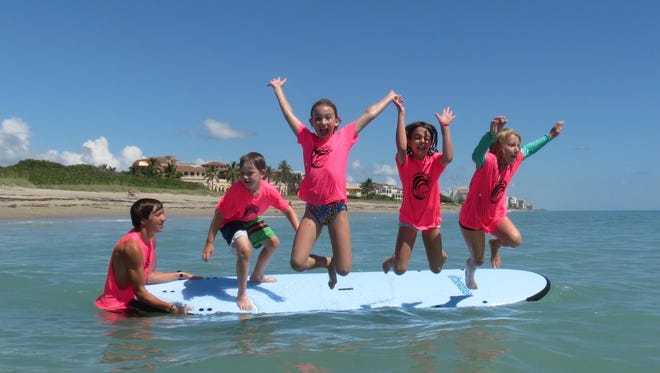 In addition to hosting stand-up paddleboard tours and parties, Cowabunga Surf & Sport has children’s camps and lessons for adults and children.