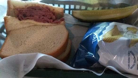 Kelley's Irish Pub and Deli's  pastrami sandwich on white bread with spicy mustard.