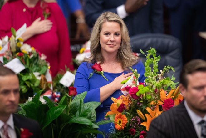 Rep. Jenna Persons-Mulicka places her hand over her heart during the Pledge of Allegiance on the opening day of the 2023 Florida Legislative Session, Tuesday, March 7, 2023.