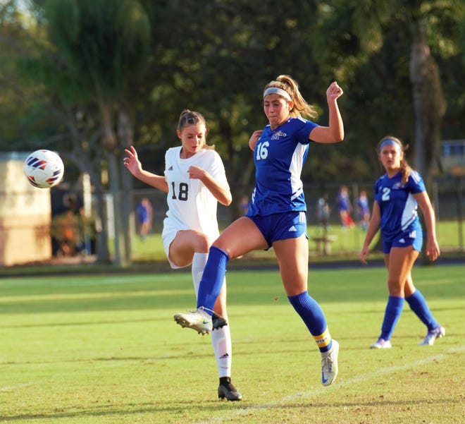 Martin County's Kacey O'Donnell and Treasure Coast's Daniella Bianchini duel for the ball during a high school soccer match on Tuesday, Nov. 15, 2022 at Martin County High School in Stuart. The Titans won the match 4-0.