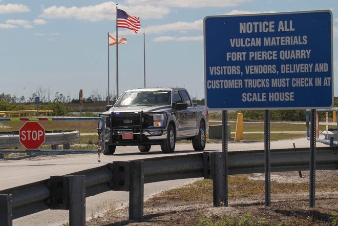 The St. Lucie County Sheriff's Office stands watch at the front gates of the Vulcan Materials quarry along Range Line Road while investigating a possible fatal industrial accident on Thursday, March 16, 2023.