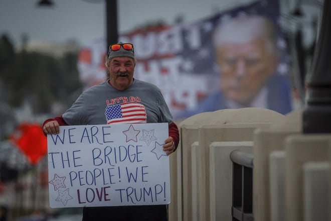 Supporters of former President Donald Trump congregate just west of Mar-a-Lago on Southern Boulevard in Palm Beach on Sunday, March 19, 2023.