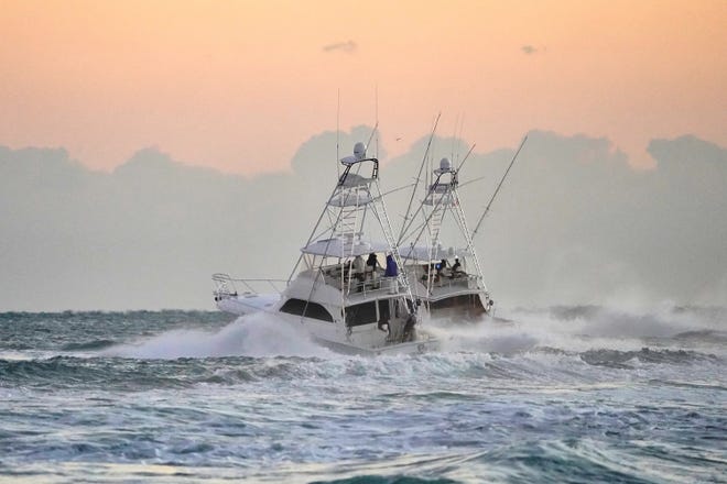 Sportfishing boats head out of the Fort Pierce Inlet during the 42nd annual Pelican Yacht Club Invitational Billfish Tournament on Friday, Jan. 14, 2022. Sport fishing and boating are popular events for tourists and locals.