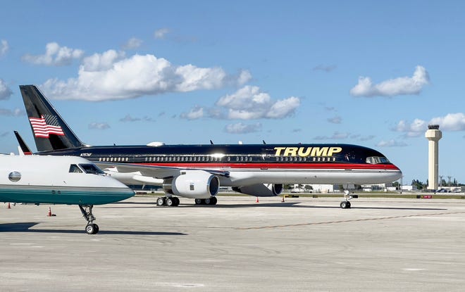 Former President Donald Trump's Boeing 757 private jet, seen here at Palm Beach International Airport in West Palm Beach, often referred to as "Trump Force One," would have looked similar to the real Air Force One that's being renovated.