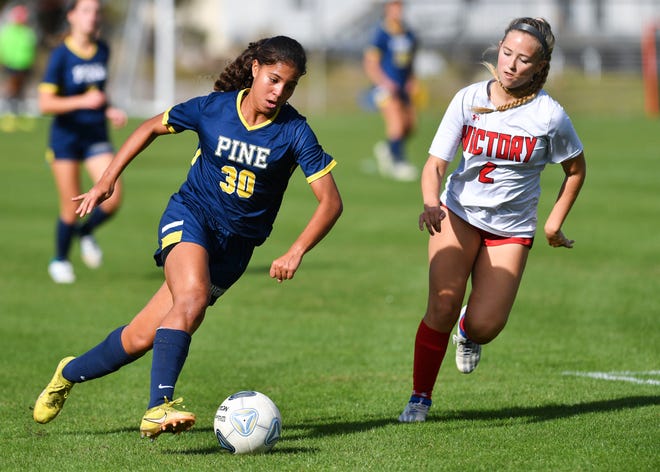 The Pine School's Giovanna Waksman (30) dribbles down field against Victory Christian Academy in a high school girls soccer Region 2-2A quarterfinal on Tuesday, Feb. 7, 2023, in Hobe Sound. The Pine School won 8-1.