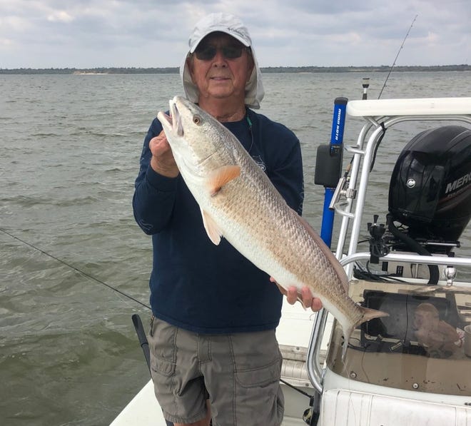Art Mowery with one of nine large reds he caught and released midweek in the Oak Hill area.