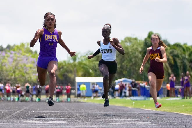Fort Pierce Central's Richelle Williams (left) competes in the girls 100-meter race during the District 10-4A Track and Field Championship on Friday, April 22, 2022 at Martin County High School in Stuart.