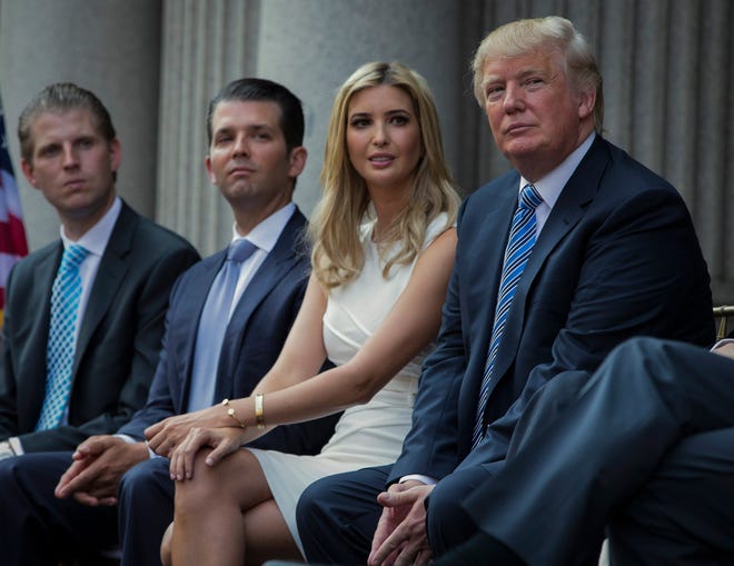 Donald Trump with his children in 2014. From left, Eric, Donald Jr. and Ivanka.