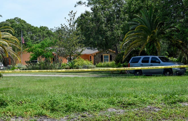 A Martin County Sheriff's Office vehicle (right) stands watch at a home along Southwest Honey Terrace on Wednesday, June 22, as the Martin County Sheriff's Office is investigating a homicide that was reported Tuesday evening.