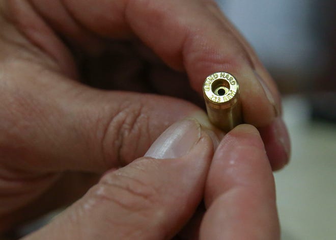 Principal owner Barry Skolnick holds a shell casing while giving a tour of the new Grind Hard Ammo facility, Thursday, Feb. 23, 2023, at the Willoughby Business Park in Stuart. "We want to make the best ammo," said Skolnick. Grind Hard Ammo manufactures copper shell casings at the Stuart facility and plans to build a facility in Indiantown, where they would make primers, or the explosive substance that energizes the powder in the case of each shell. The company primarily sells ammunition to law enforcement and the military. Its website sells consumer ammunition and merchandise such as T-shirts and hats. The facility is not open to the public.