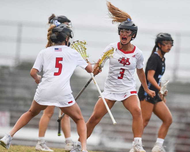 Vero Beach's Alexa Vega (3) celebrates her point against Hagerty in the Region 2-2A girls lacrosse championship Friday, April 29, 2022, at Vero Beach High School. Vero Beach won 13-3.