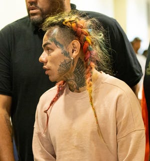 HOUSTON, TX - AUGUST 22:  Rapper Tekashi69, real name Daniel Hernandez and also known as 6ix9ine, Tekashi 6ix9ine, Tekashi 69,  arrives for his arraignment on assault charges in County Criminal Court #1 at the Harris County Courthouse on August 22, 2018 in Houston, Texas.