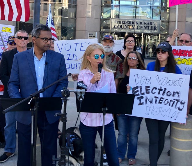 Defend Florida co-founder Caroline Wetherington speaks at a 2022 rally in Tampa. The group has been investigating alleged “voting irregularities” in Florida and advocating for changes to election law based on their findings, but elections officials say they have failed to produce evidence to support their claims.