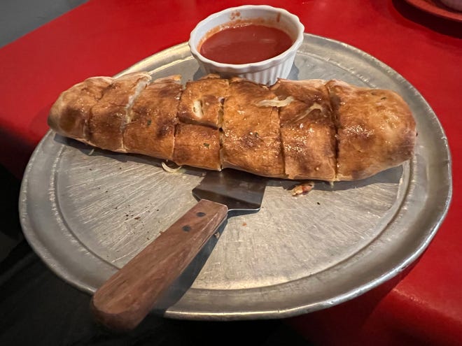 The medium stromboli at Da Vinci's Italian Grill was enormous and jam-packed with an entire Italian kitchen: pepperoni, sausage, tomatoes, onions, peppers and mozzarella served with a robust marinara sauce chaser.