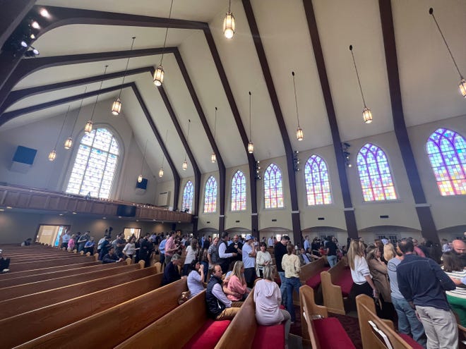 Parents wait for their children, Monday March 27, 2023 after a school shooting at Covenant School in Green Hills, Nashville