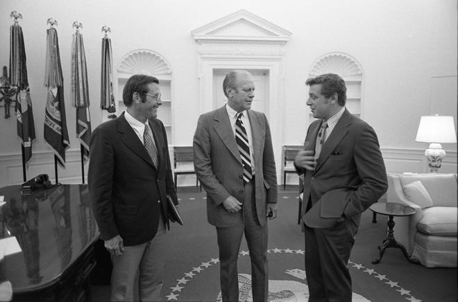 In this August 1974 photo, courtesy of the Gerald R. Ford Presidential Library and the U.S. National Archives, Benton Becker, right, chats with President Ford, center, and Donald Rumsfeld, left.