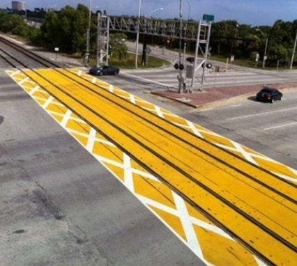 Brightline plans to add dynamic pavement markings at crossings to keep drivers from getting too close to railroad tracks. As drivers approach the critical zone, they are able to see the markings with X's and will not venture onto the zone.