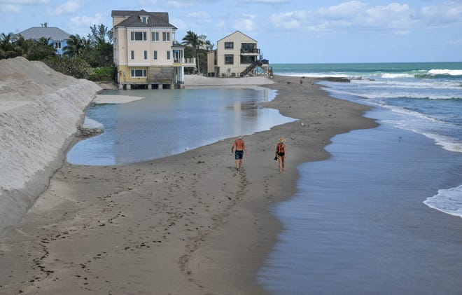 Erosion is seen along with the new sand dune on the north side of the boardwalk on Thursday, March 9, 2022, at Bathtub Reef Beach in Stuart. A work crew with Shoreline Foundation Inc., of West Park, is building a seawall within the beach to help protect the beach and McArthur Boulevard from erosion and flooding from passing storms.