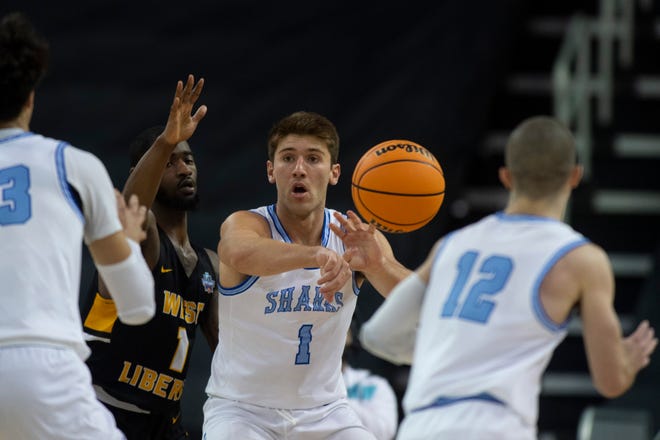 Nova Southeastern’s Ryan Davis (1) passes to Dallas Graziani (12) as the Nova Southeastern University Sharks play the West Liberty Hilltoppers during the championship game of the 2023 NCAA Division II Men’s basketball tournament at Ford Center in Downtown Evansville, Ind., Saturday afternoon, March 25, 2023.