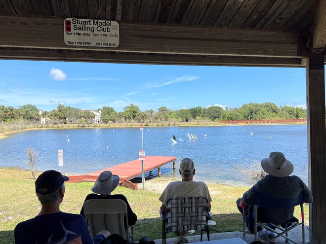 Members of the Stuart Model Sailing Club race their boats at Poppleton Creek Dog Park on Thursday, April 6, 2023.