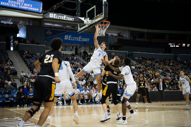 Nova Southeastern’s Ryan Davis (1) takes a shot as the Nova Southeastern University Sharks play the West Liberty Hilltoppers during the championship game of the 2023 NCAA Division II Men’s basketball tournament at Ford Center in Downtown Evansville, Ind., Saturday afternoon, March 25, 2023.