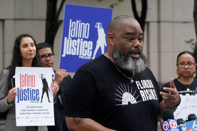 Joined by members of civil rights and voting rights groups, former Florida Sen. Dwight Bullard speaks during a Miami news conference in September.