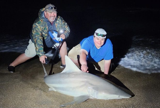 Dan and Michael, father-son from Indiana, caught and released this 6-foot-3 blacktip with New Smyrna Shark Hunters.