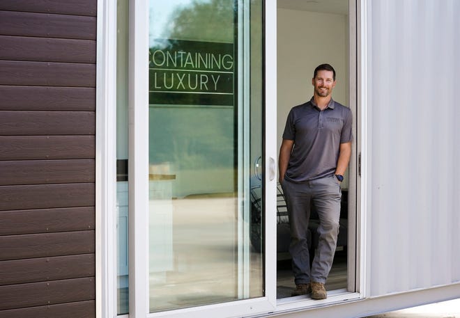 Blake Madgett, CEO and founder of Containing Luxury, stands in the 40-foot container home model, Friday, March 17, 2023, at 4402 SW Port Way in Palm City. The company converts steel shipping containers into tiny homes and is one of more than 100 businesses in the tri-county area that is a Second Chance employer, which seeks to hire some people looking for a fresh start after coming out of prison, participating in a diversion court program, or who are in recovery.