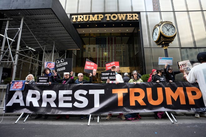 Protesters gather outside Trump Tower on Friday, March 31, 2023, in New York. Former President Donald Trump was indicted by a Manhattan grand jury the day before, an historic reckoning after years of investigations into his personal, political and business dealings and an abrupt jolt to his bid to retake the White House.